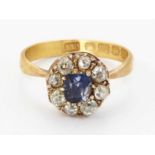 A 22 CARAT GOLD SAPPHIRE AND DIAMOND CLUSTER RING