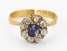 A 22 CARAT GOLD SAPPHIRE AND DIAMOND CLUSTER RING