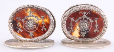 A PAIR OF GEORGE V SILVER AND TORTOISESHELL MENU HOLDERS