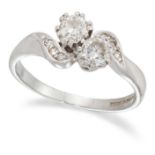 AN 18 CARAT WHITE GOLD DIAMOND TWO STONE CROSSOVER RING