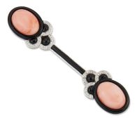 AN ART DECO STYLE CORAL, ENAMEL AND DIAMOND BROOCH