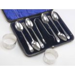 A SET OF SIX GEORGE III SILVER TEASPOONS, AND A PAIR OF EDWARDIAN SILVER NAPKIN RINGS