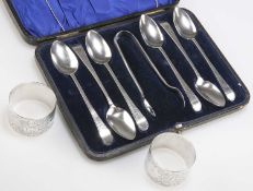 A SET OF SIX GEORGE III SILVER TEASPOONS, AND A PAIR OF EDWARDIAN SILVER NAPKIN RINGS