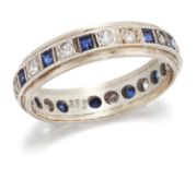A 9 CARAT GOLD SAPPHIRE AND WHITE SPINEL ETERNITY RING