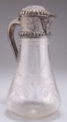 A VICTORIAN SILVER-MOUNTED CLARET JUG