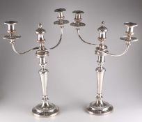 A PAIR OF GEORGE III SILVER AND OLD SHEFFIELD PLATE CANDELABRA