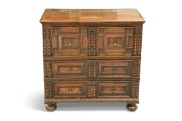 A 17TH CENTURY OAK MOULDED-FRONT CHEST OF DRAWERS
