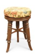 A REGENCY ROSEWOOD REVOLVING PIANO STOOL