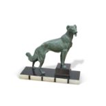 AN ART DECO STYLE PATINATED SPELTER MODEL OF A DOG