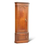 A CORNER MAHOGANY GUN CABINET