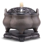 A CHINESE PATINATED BRONZE CENSER