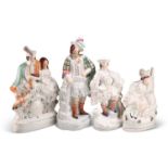 A GROUP OF FOUR VICTORIAN STAFFORDSHIRE FLAT-BACK FIGURES