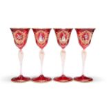 A SET OF THREE VENETIAN RUBY GLASS CHAMPAGNE COUPES AND FOUR WINES