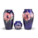 THREE WALTER MOORCROFT ANEMONE PATTERN TUBE LINED POTTERY VASES