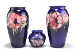 THREE WALTER MOORCROFT ANEMONE PATTERN TUBE LINED POTTERY VASES