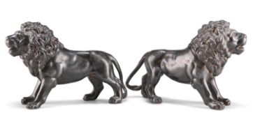 A PAIR OF 19TH CENTURY PATINATED METAL LIONS