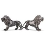 A PAIR OF 19TH CENTURY PATINATED METAL LIONS