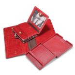 A CARTIER RED LEATHER CIGARETTE CASE; A MULBERRY RED CONGO LEATHER PURSE AND MATCHING CASH SLIP