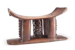 A WEST AFRICAN ASHANTI STOOL OR HEAD REST, LATE 19TH/EARLY 20TH CENTURY