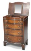A GEORGE III STYLE MAHOGANY SERPENTINE BACHELOR’S CHEST, EARLY 20TH CENTURY,