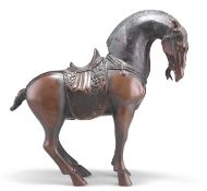 A CHINESE PATINATED BRONZE MODEL OF A TANG STYLE HORSE