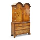 AN 18TH CENTURY STYLE BURR WALNUT DOUBLE DOME TOPPED CABINET ON CHEST, EARLY 20TH CENTURY