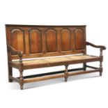 AN 18TH CENTURY OAK SETTLE