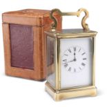 AN EARLY 20TH CENTURY BRASS STRIKING CARRIAGE CLOCK