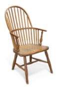 AN EARLY 19TH CENTURY PRIMITIVE HOOP AND STICK BACK WINDSOR CHAIR