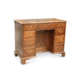 A GEORGE III STYLE INLAID OAK KNEE-HOLE DESK