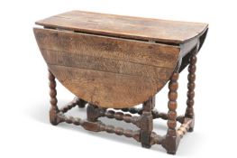 AN 18TH CENTURY OAK GATELEG TABLE