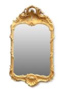 A ROCOCO REVIVAL CARVED GILTWOOD MIRROR
