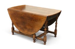 A LARGE TITCHMARSH AND GOODWIN OAK GATELEG DINING TABLE