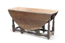 A LARGE 18TH CENTURY OAK GATELEG TABLE