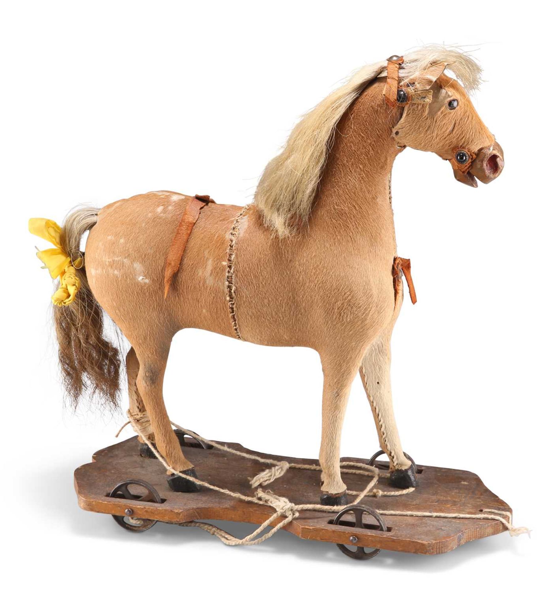 A VICTORIAN PULL-ALONG TOY HORSE