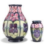 TWO MOORCROFT VIOLET PATTERN TUBE LINED POTTERY VASES