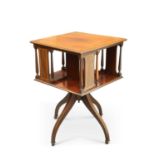 AN EDWARDIAN INLAID MAHOGANY REVOLVING BOOKCASE TABLE