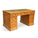 A VICTORIAN STRIPPED PINE PEDESTAL DESK