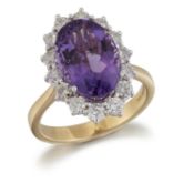 AN 18 CARAT GOLD AMETHYST AND DIAMOND CLUSTER RING