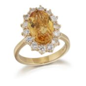 AN 18 CARAT GOLD CITRINE AND DIAMOND CLUSTER RING