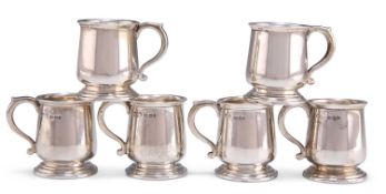 A SET OF SIX GEORGE V SILVER TOY TANKARDS