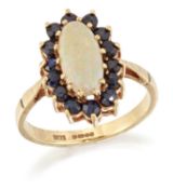 A 9 CARAT GOLD OPAL AND SAPPHIRE CLUSTER RING