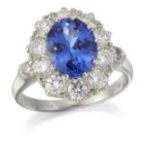 A TANZANITE AND DIAMOND CLUSTER RING