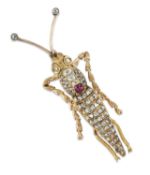 AN EARLY 20TH CENTURY DIAMOND AND RUBY NOVELTY CRICKET BROOCH