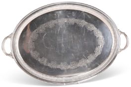 AN EDWARDIAN SILVER-PLATED TWO-HANDLED TRAY