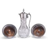 A VICTORIAN STYLE SILVER-PLATE MOUNTED CLARET JUG AND A PAIR OF GARRARD SILVER-PLATED WINE COASTERS