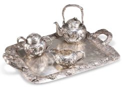 A FINE JAPANESE SILVER FOUR-PIECE TEA SERVICE