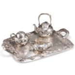 A FINE JAPANESE SILVER FOUR-PIECE TEA SERVICE