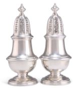 A PAIR OF GEORGIAN STYLE CAST SILVER SUGAR CASTERS