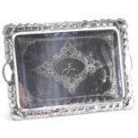 AN EDWARDIAN SILVER-PLATED TWO-HANDLED TRAY